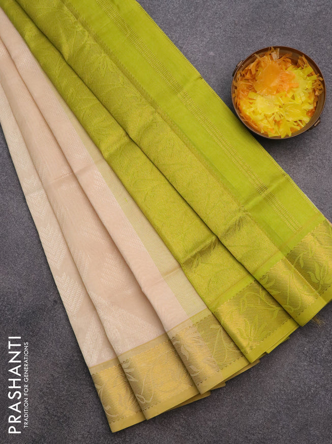 Silk cotton saree cream and light green with allover self emboss & jacquard and rich zari woven border