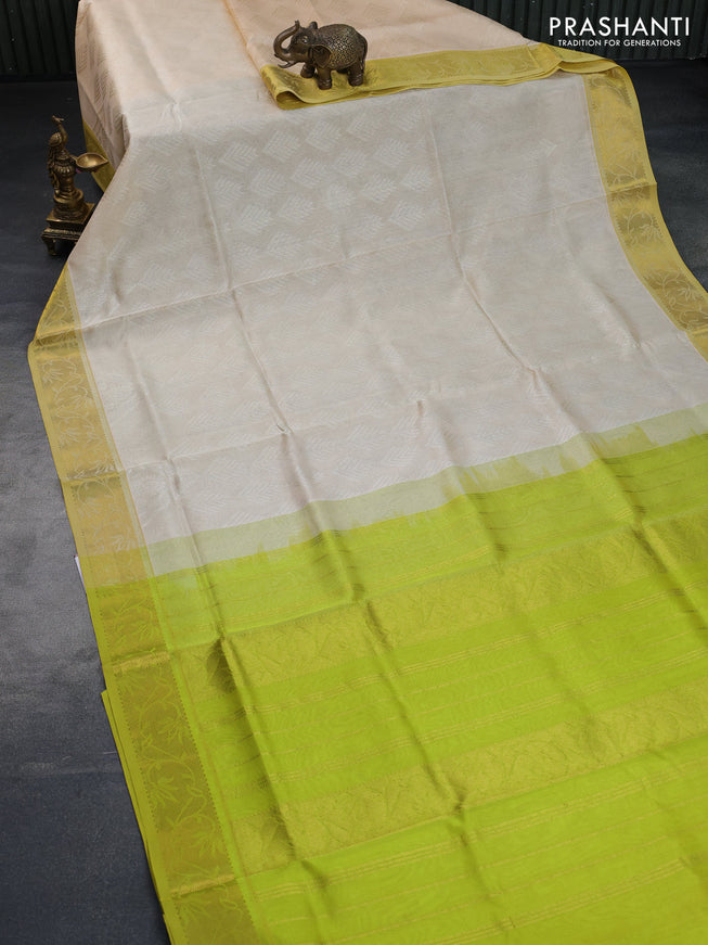 Silk cotton saree cream and light green with allover self emboss & jacquard and rich zari woven border