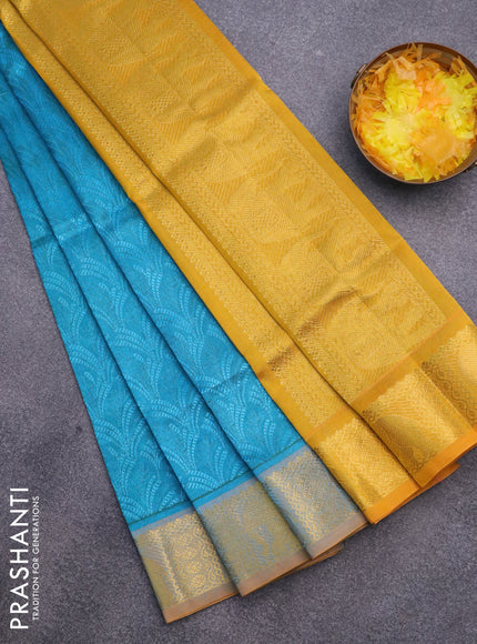 Silk cotton saree dual shade of blue and mustard yellow with allover self emboss & jacquard and elephant zari woven border