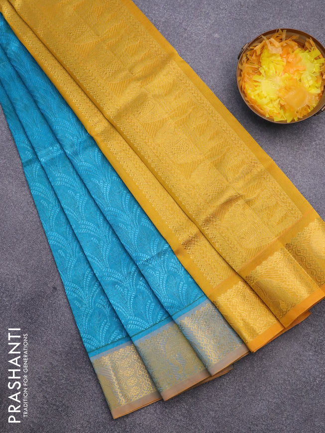 Silk cotton saree dual shade of blue and mustard yellow with allover self emboss & jacquard and elephant zari woven border