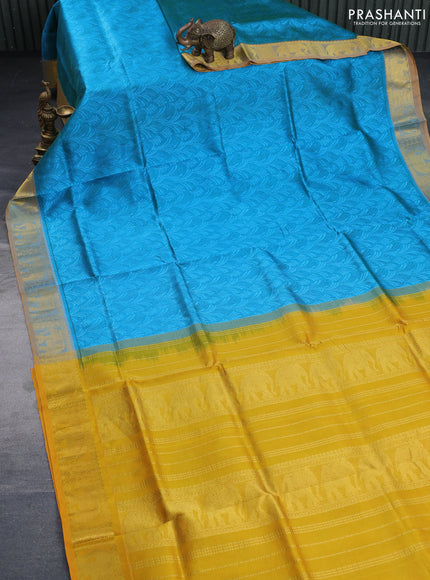 Silk cotton saree dual shade of blue and mustard yellow with allover self emboss & jacquard and elephant zari woven border