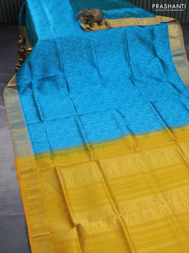 Silk cotton saree dual shade of blue and mustard yellow with allover self emboss & jacquard and elephant zari woven border