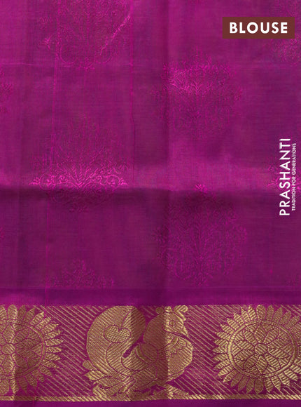 Silk cotton saree dual shade of green and magenta pink with allover self emboss & jacquard and rudhraksha & annam zari woven border