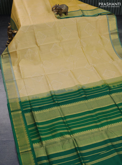 Silk cotton saree yellow and green with allover self emboss & jacquard and zari woven border