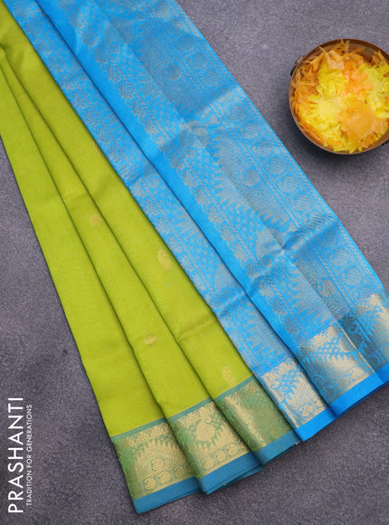 Silk cotton saree flourescent green and cs blue with zari woven buttas and rich zari woven border