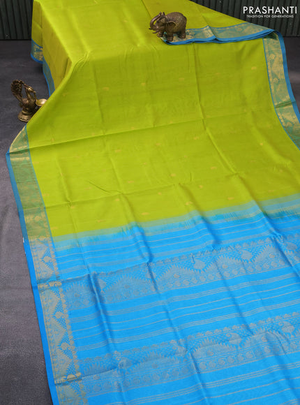 Silk cotton saree flourescent green and cs blue with zari woven buttas and rich zari woven border