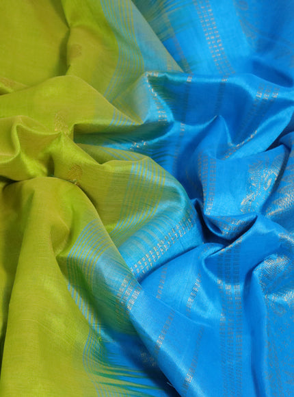 Silk cotton saree flourescent green and cs blue with zari woven buttas and rich zari woven border