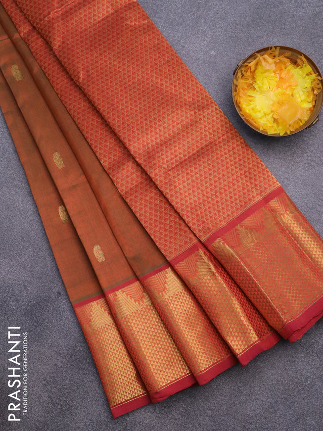 Silk cotton saree dual shade of rustic green and rustic orange with paisley zari woven buttas and long zari woven border