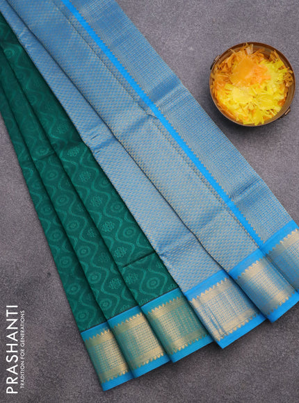 Silk cotton saree peacock green and cs blue with allover self emboss & jacquard and zari woven border