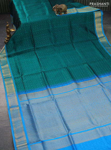 Silk cotton saree peacock green and cs blue with allover self emboss & jacquard and zari woven border