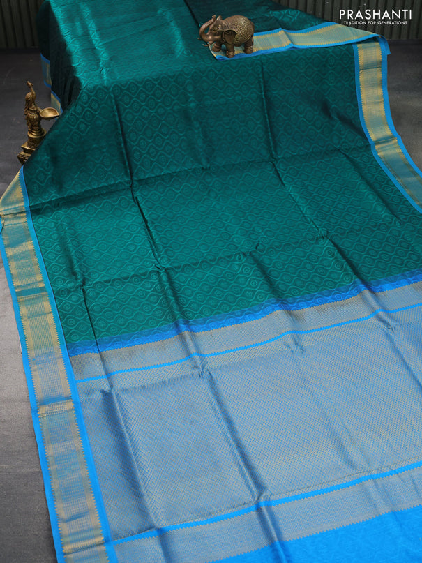 Silk cotton saree peacock green and cs blue with allover self emboss & jacquard and zari woven border