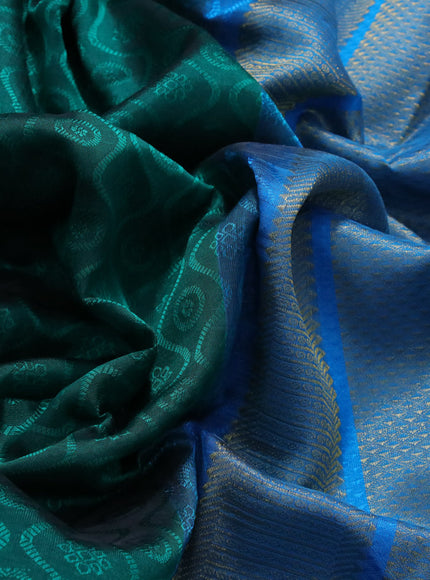 Silk cotton saree peacock green and cs blue with allover self emboss & jacquard and zari woven border