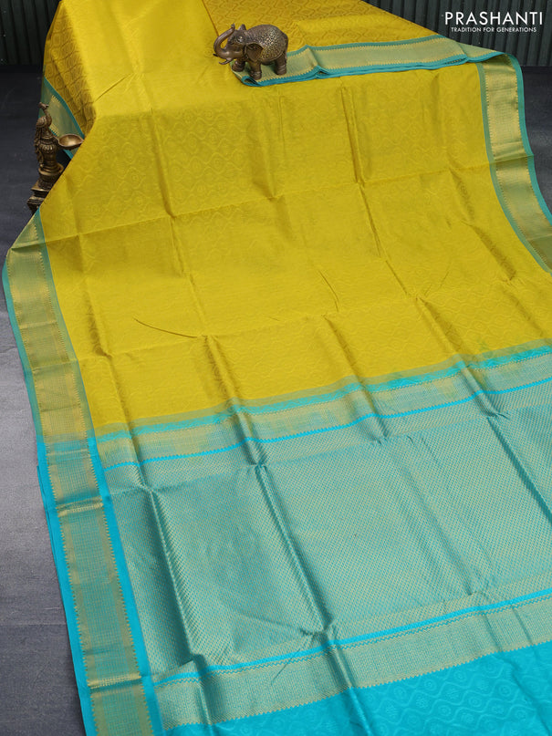 Silk cotton saree mustard yellow and teal green shade with allover self emboss & jacquard and zari woven border