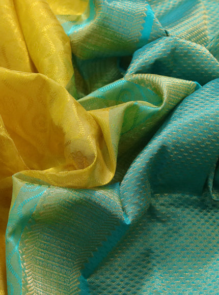 Silk cotton saree mustard yellow and teal green shade with allover self emboss & jacquard and zari woven border