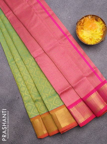 Silk cotton saree dual shade of teal bluish green and pink with allover self emboss & jacquard and zari woven border