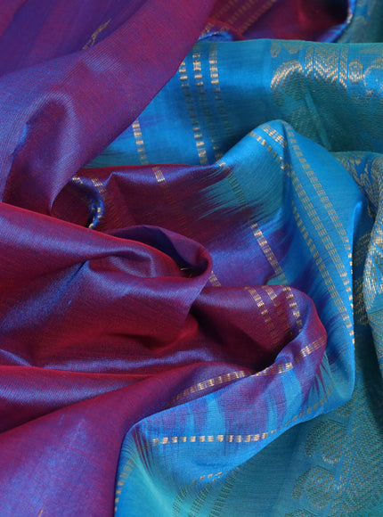 Silk cotton saree dual shade of bluish maroon and cs blue with zari woven buttas and annam zari woven border