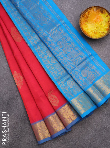 Silk cotton saree dual shade of pinkish orange and cs blue with zari woven buttas and annam zari woven border