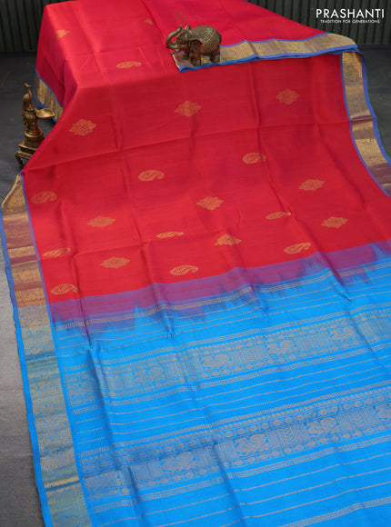 Silk cotton saree dual shade of pinkish orange and cs blue with zari woven buttas and annam zari woven border