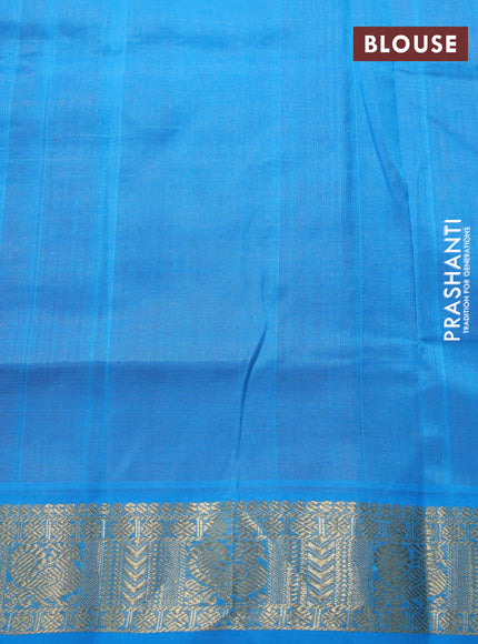 Silk cotton saree dual shade of pinkish orange and cs blue with zari woven buttas and annam zari woven border