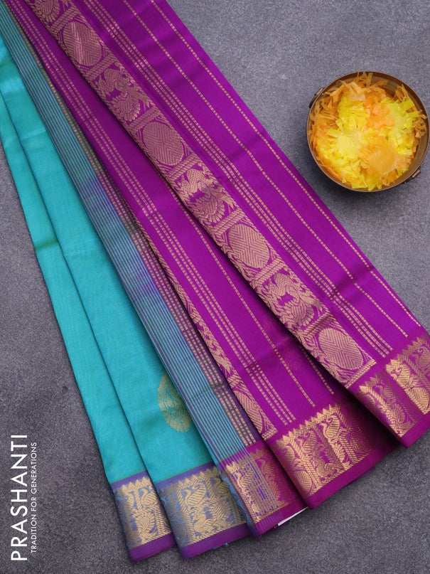 Silk cotton saree dual shade of teal bluish green and purple with paisley zari woven buttas and zari woven border