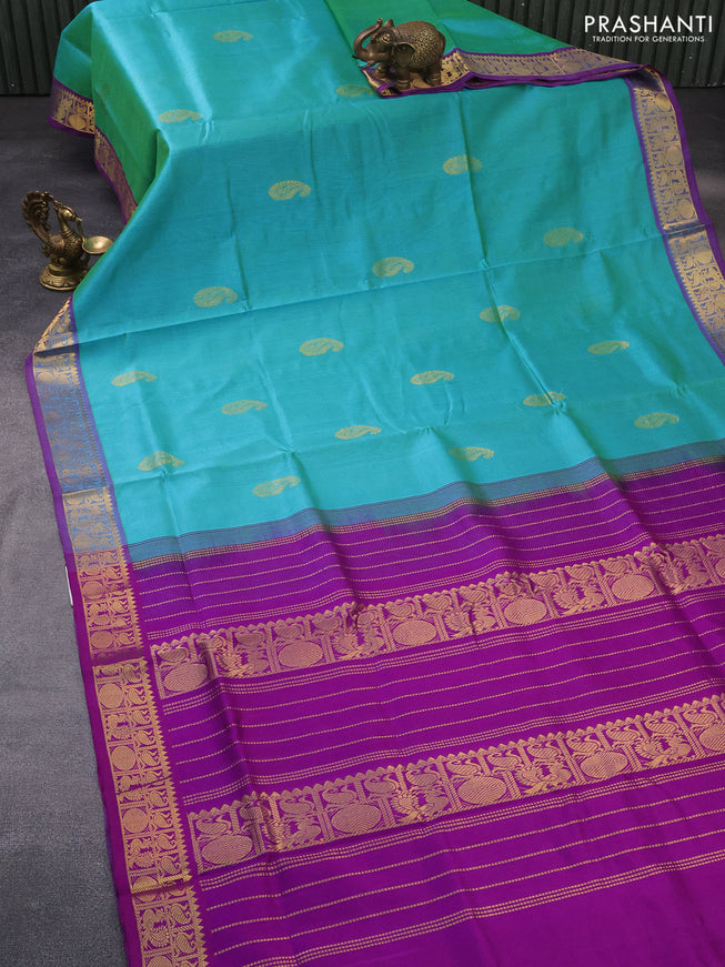 Silk cotton saree dual shade of teal bluish green and purple with paisley zari woven buttas and zari woven border