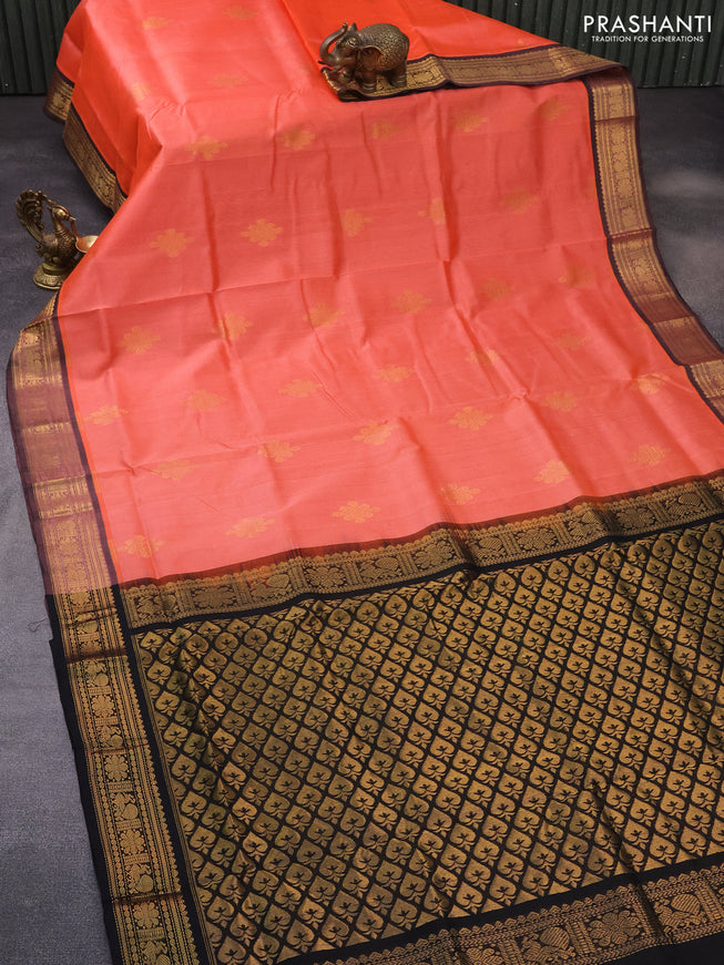 Silk cotton saree peach orange and black with zari woven buttas and annam zari woven border