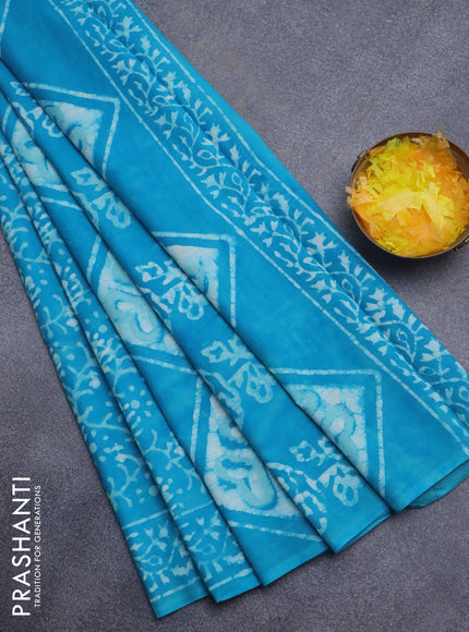 Jaipur cotton saree light blue with allover batik prints and printed border