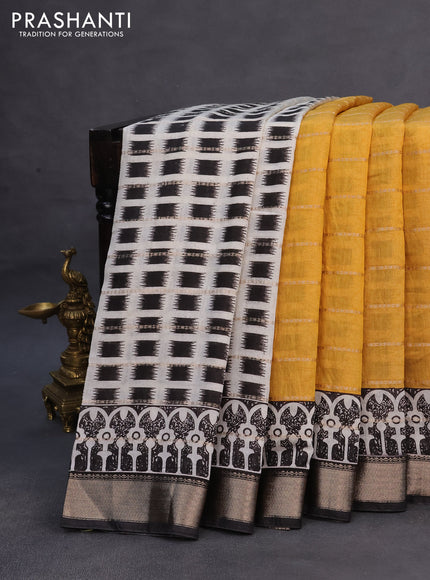 Assam partly silk saree mustard yellow and black with allover prints & zari weaves and zari woven border