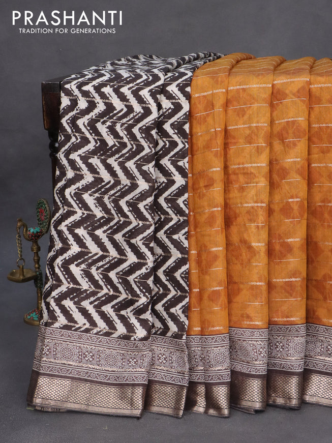 Assam partly silk saree dark mustard and black with digital prints & zari weaves and zari woven border