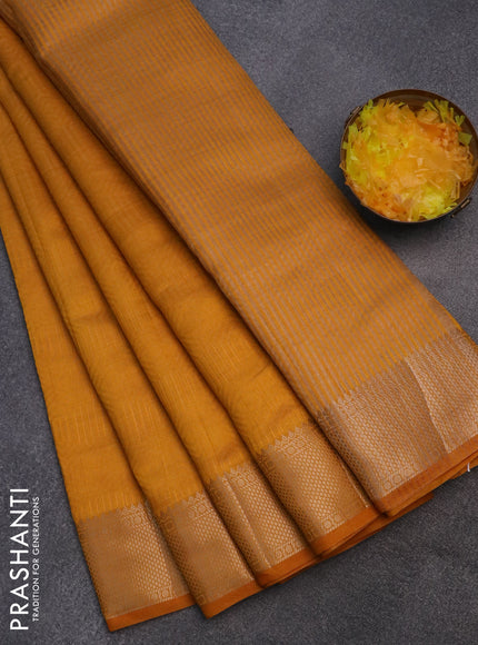 Semi raw silk saree mustard yellow with allover self emboss and zari woven border