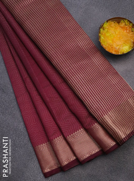 Semi raw silk saree wine shade with allover self emboss and zari woven border