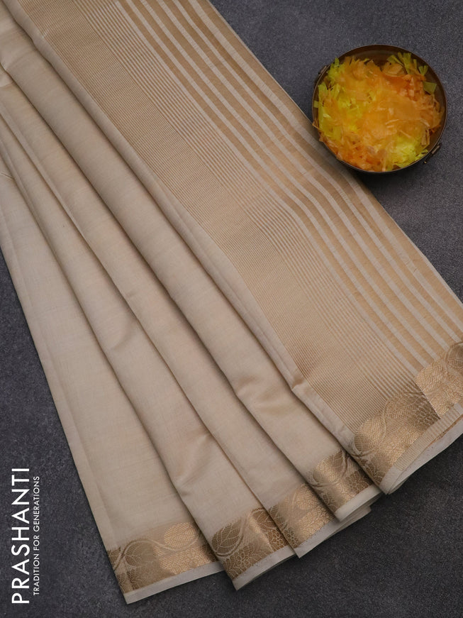 Semi raw silk saree cream with plain body and leaf design zari woven border