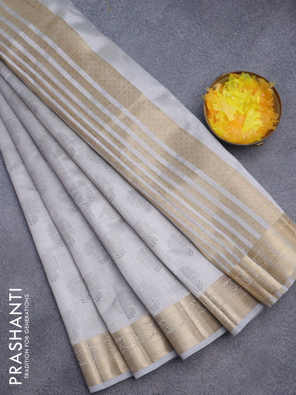 Semi raw silk saree pastel grey with butta prints and zari woven border