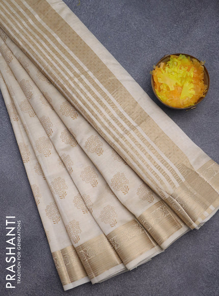 Semi raw silk saree cream with butta prints and zari woven border