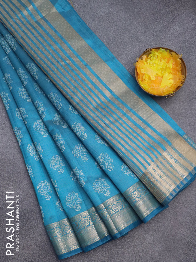 Semi raw silk saree cs blue with butta prints and zari woven border