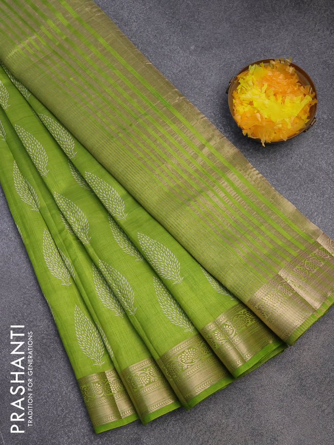 Semi raw silk saree light green with butta prints and zari woven border