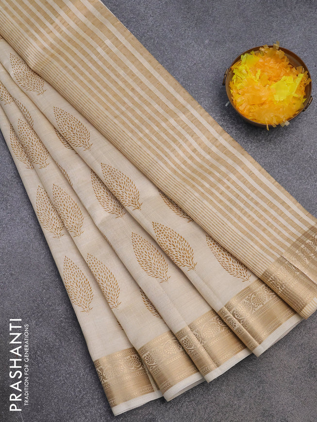 Semi raw silk saree cream with butta prints and zari woven border