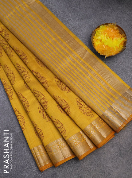 Semi raw silk saree mustard yellow with butta prints and zari woven border