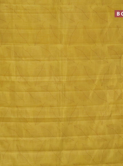 Semi raw silk saree yellow with allover leaf prints and zari woven border