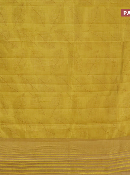 Semi raw silk saree yellow with allover leaf prints and zari woven border