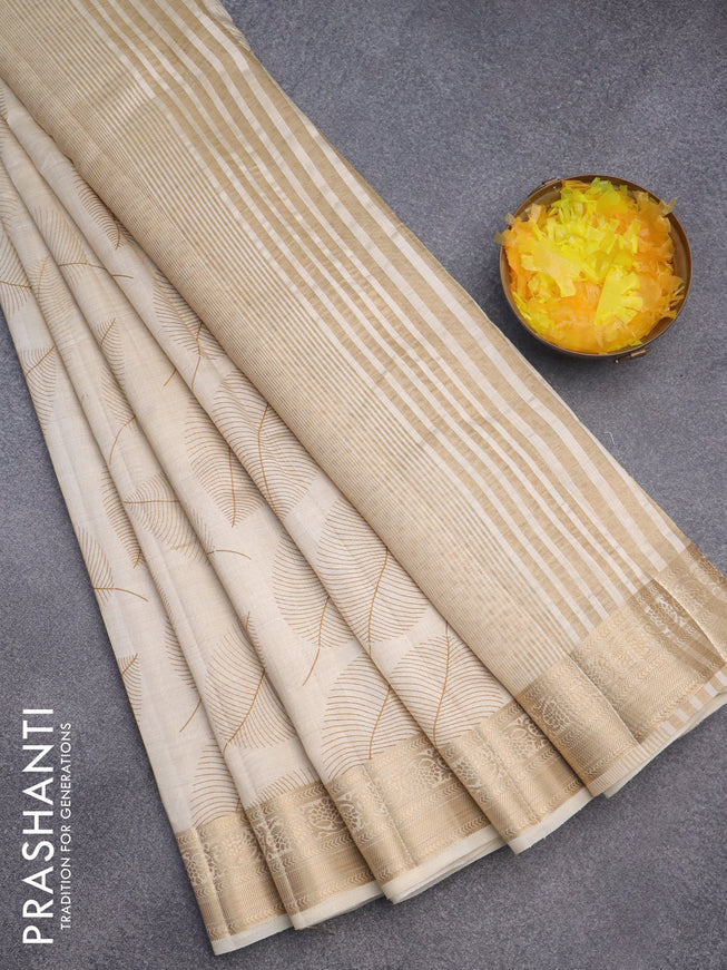 Semi raw silk saree beige with allover leaf prints and zari woven border