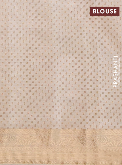 Semi raw silk saree beige with allover leaf prints and zari woven border