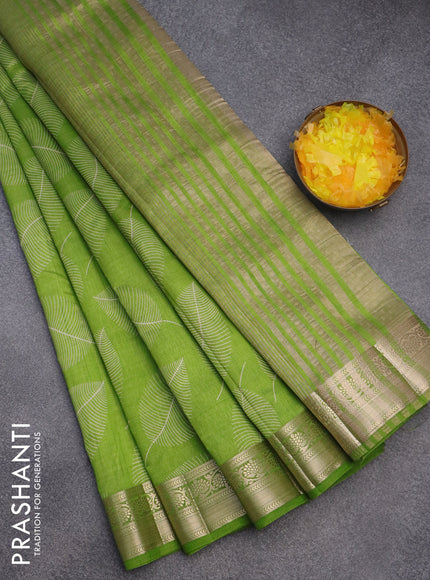 Semi raw silk saree light green with allover leaf prints and zari woven border