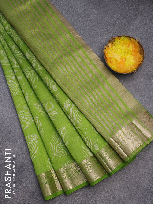 Semi raw silk saree light green with allover leaf prints and zari woven border