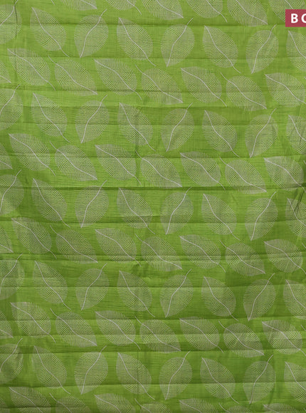 Semi raw silk saree light green with allover leaf prints and zari woven border