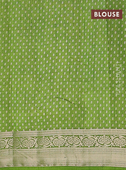 Semi raw silk saree light green with allover leaf prints and zari woven border