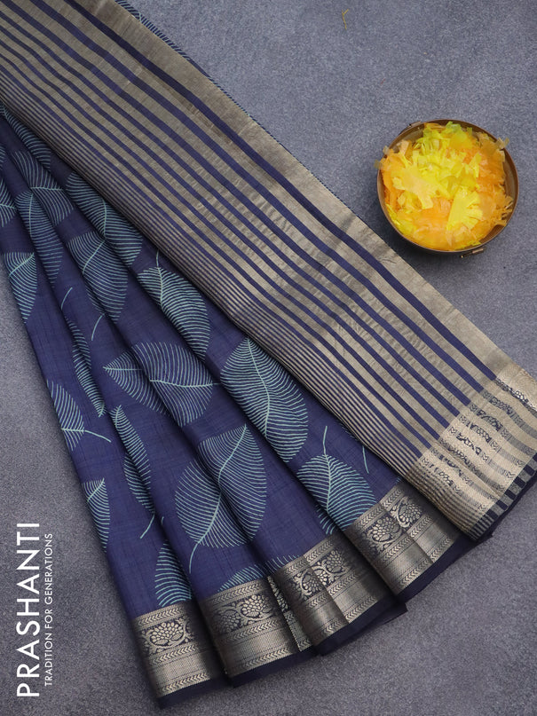 Semi raw silk saree navy blue with allover leaf prints and zari woven border