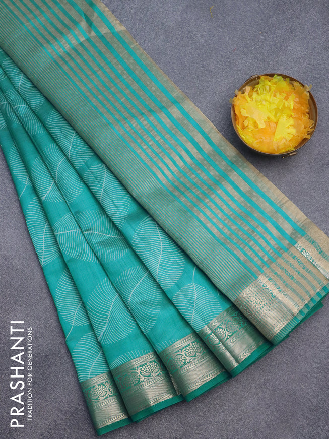 Semi raw silk saree teal blue with allover leaf prints and zari woven border