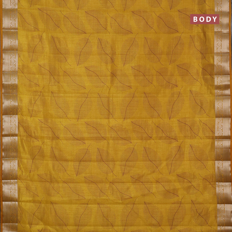 Semi raw silk saree mustard yellow with allover leaf prints and zari woven border