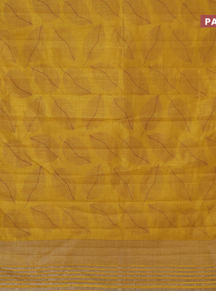 Semi raw silk saree mustard yellow with allover leaf prints and zari woven border